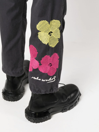 Shop Maharishi Floral-print Slim-fit Trousers In Black