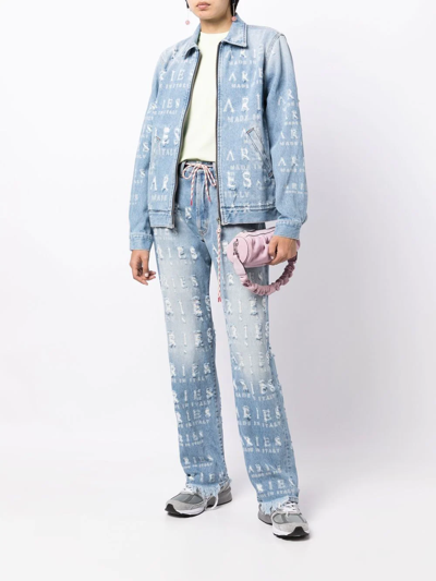 Shop Aries Distressed Logo-lettering Jeans In Blue