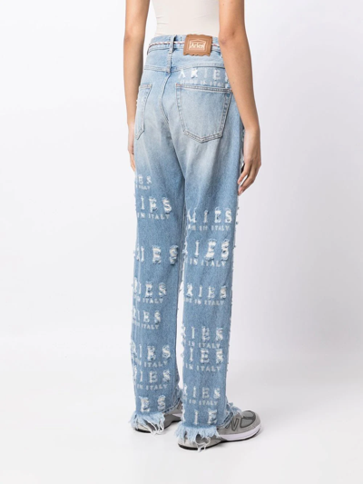 Shop Aries Distressed Logo-lettering Jeans In Blue