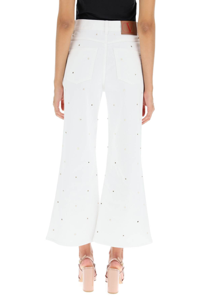 Shop Valentino Cropped Jeans With Studs In White