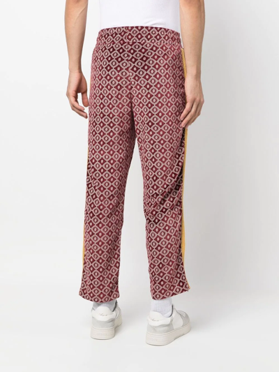 Shop Drôle De Monsieur Geometric-print Side-stripe Trousers In Rot