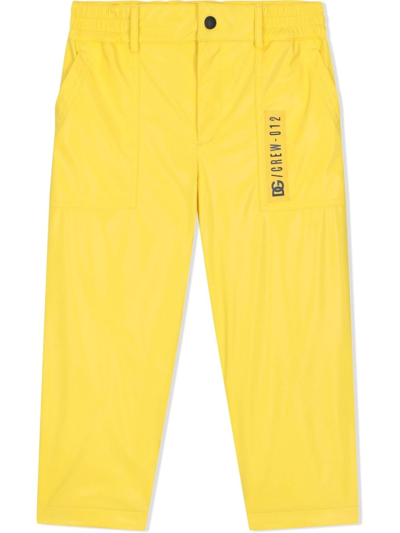 Dolce & Gabbana Coated-nylon Worker Trousers In Yellow