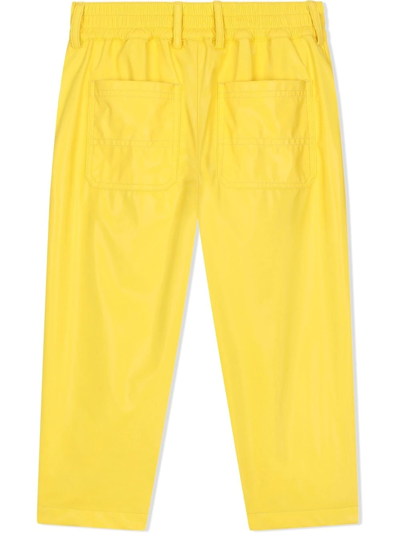 Shop Dolce & Gabbana Coated-nylon Worker Trousers In Yellow