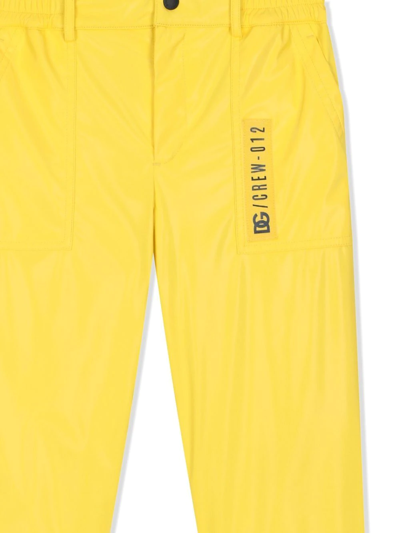 Shop Dolce & Gabbana Coated-nylon Worker Trousers In Yellow