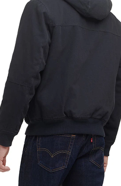 Shop Levi's® Workwear Cotton Canvas Faux Shearling Lined Hoodie Bomber Jacket In Navy