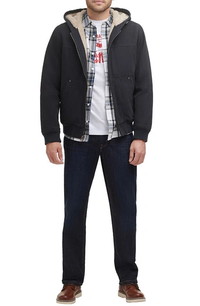 Shop Levi's® Workwear Cotton Canvas Faux Shearling Lined Hoodie Bomber Jacket In Navy