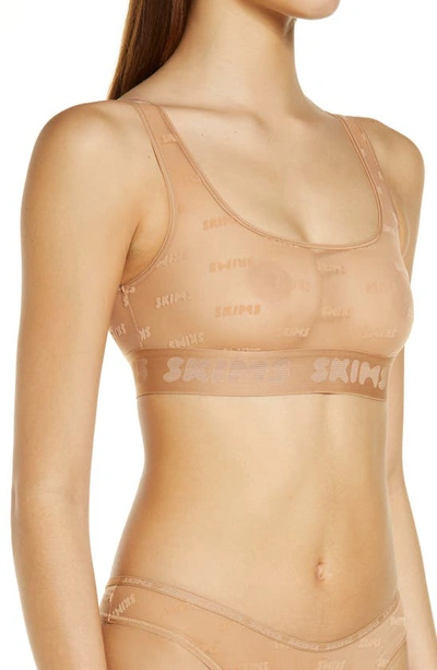 Skims Flocked Logo Mesh Bralette In Ochre