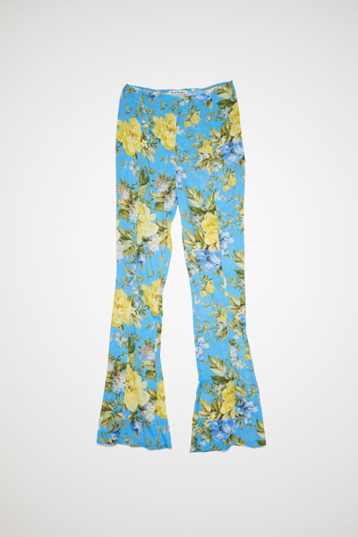 Shop Acne Studios Flower Print Flared Trousers In Blue