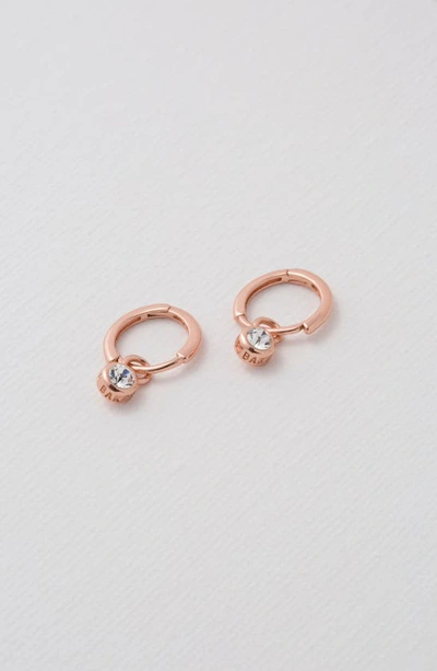 Shop Ted Baker Sinalaa Crystal Mini Huggie Hoop Earrings In Rose Gold Tone Clear Crystal