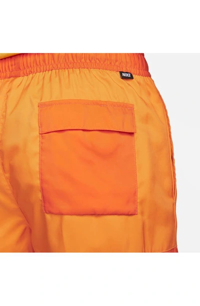 Shop Nike Essentials Colorblock Flow Shorts In Magma Orange/ Kumquat