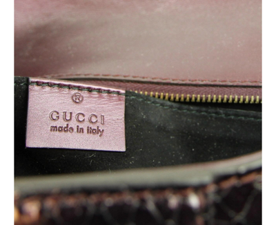 Shop Gucci Women's Python Soft Stirrup Clutch Bag 304719 In Plum
