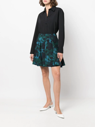 Shop Nina Ricci Abstract-print Pleated Mini Skirt In Black