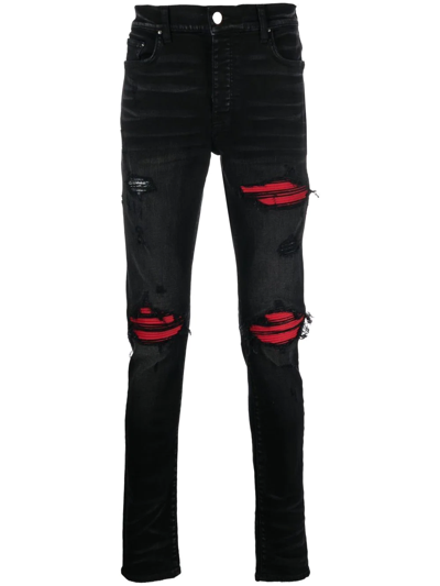 Shop Amiri Distressed Skinny-cut Jeans In Schwarz