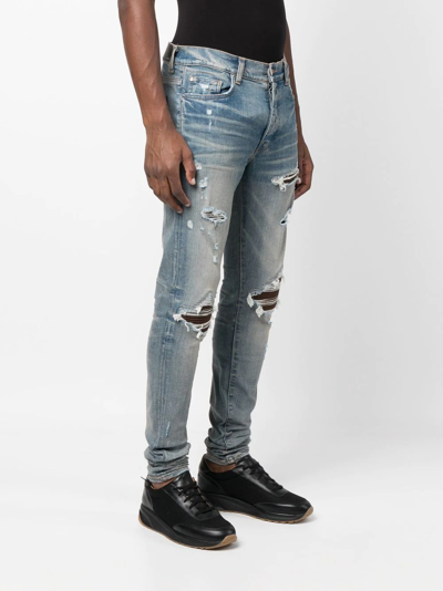 Shop Amiri Distressed Slim-cut Jeans In Blau