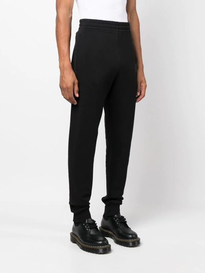 Shop Etudes Studio Leg-logo Track Pants In Schwarz