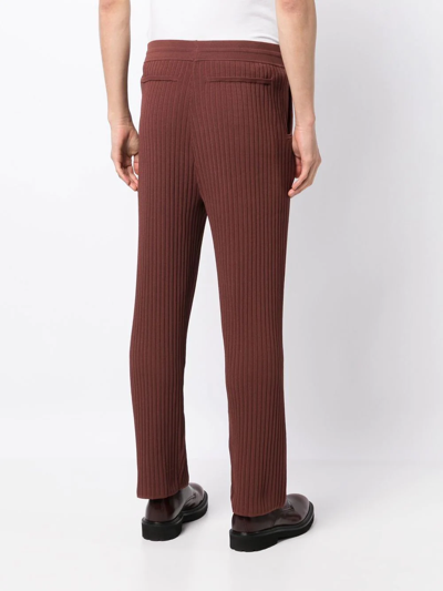 Shop Nanushka Ribbed Straight-leg Trousers In Braun
