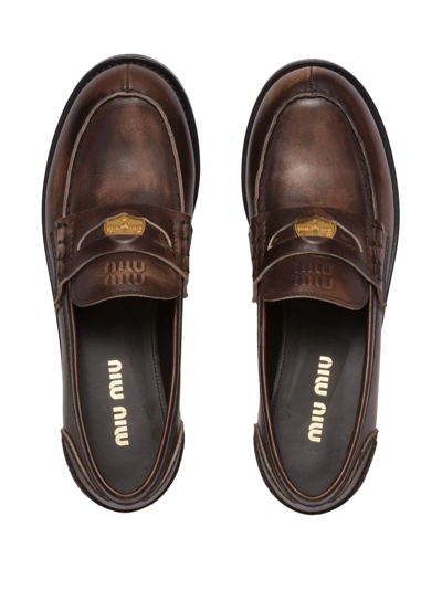 Miu Miu Logo Embossed Calf Leather Loafers In Braun