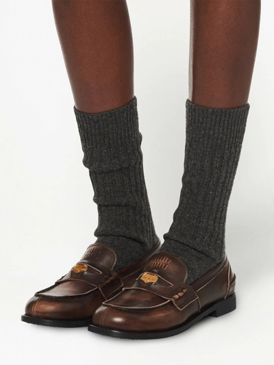 Miu Miu Logo Embossed Calf Leather Loafers In Braun
