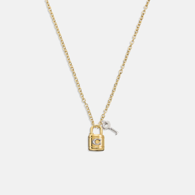 Shop Coach Outlet Signature Padlock And Key Necklace In Yellow