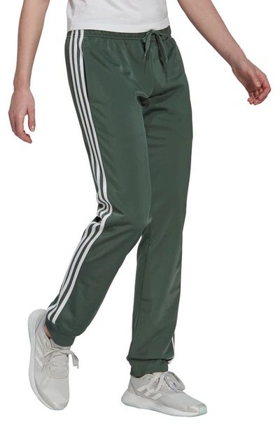 Adidas Originals Adidas Women's Essentials Warm-up Slim Tapered 3-stripes  Track Pants, Xs-4x In Green Oxide/ White | ModeSens