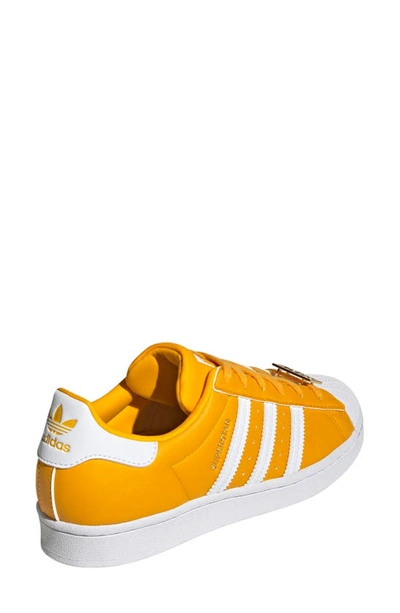 Shop Adidas Originals Superstar Sneaker In Gold/ White/ Gold Metallic