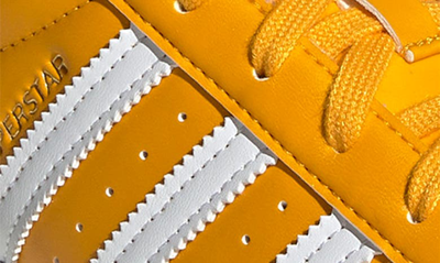 Shop Adidas Originals Superstar Sneaker In Gold/ White/ Gold Metallic