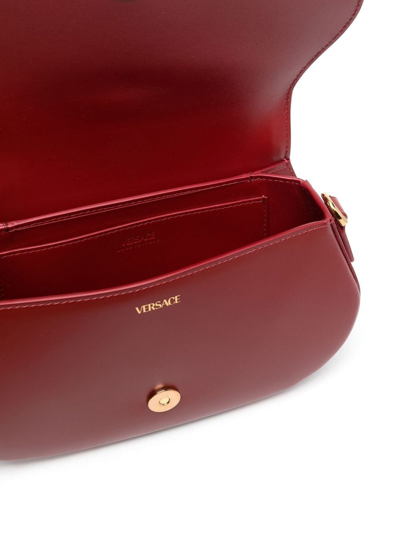 Shop Versace Leather Logo-plaque Crossbody-bag In Rot