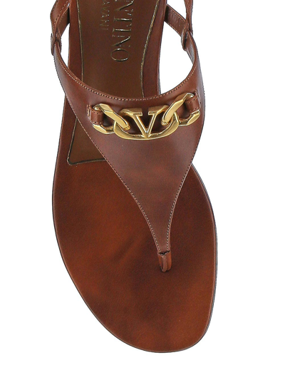 Shop Valentino Vlogo Chain Calfskin Flat Thong Sandals In Brown