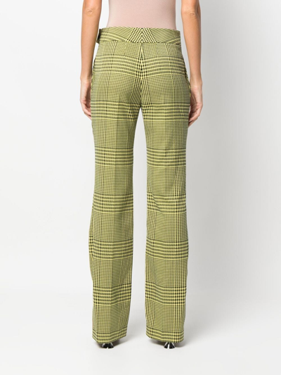 Shop Alexandre Vauthier Houndstooth-print Flared Trousers In Grün