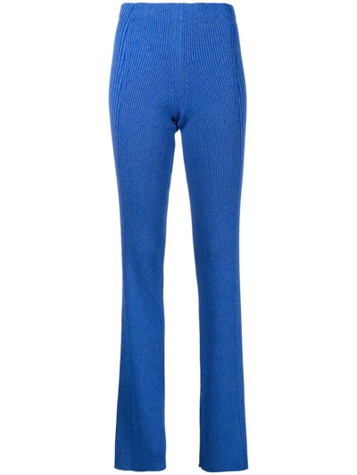 Shop Dion Lee Flared Ribbed-knit Trousers In Blau