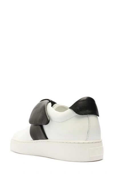 Shop Alexandre Birman Clarita Bow Slip-on Sneaker In White/ Black