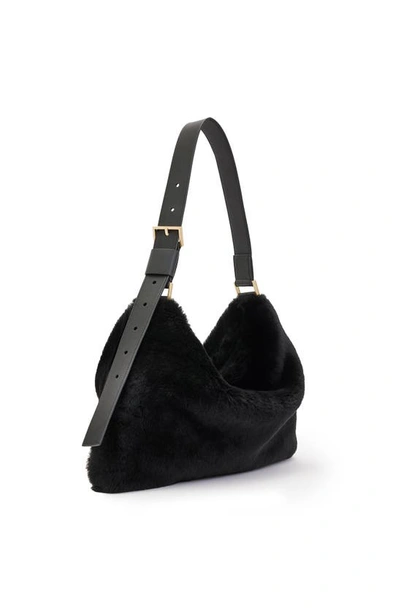Shop Allsaints Edbury Genuine Shearling Handbag In Black