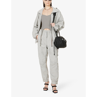 Shop Alexander Wang Logo-flocked Tapered Shell Jogging Bottoms In Alloy