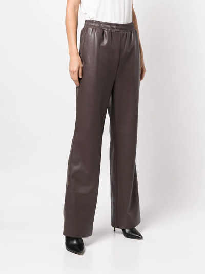 Shop Apparis Flared Faux-leather Trousers In Brown