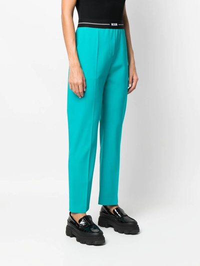 Shop Msgm Logo-waist Slim Tailored Trousers In Blau