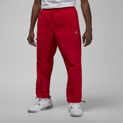 Shop Jordan Men's  Essentials Woven Pants In Red