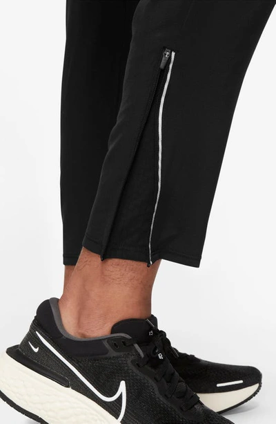 Shop Nike Dri-fit Phenom Woven Running Pants In Black/ Reflective Silver