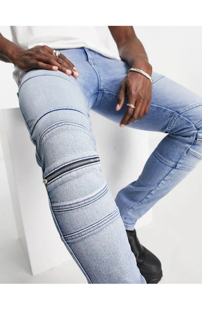 Shop Asos Design Moto Knee Zip Skinny Jeans In Mid Blue