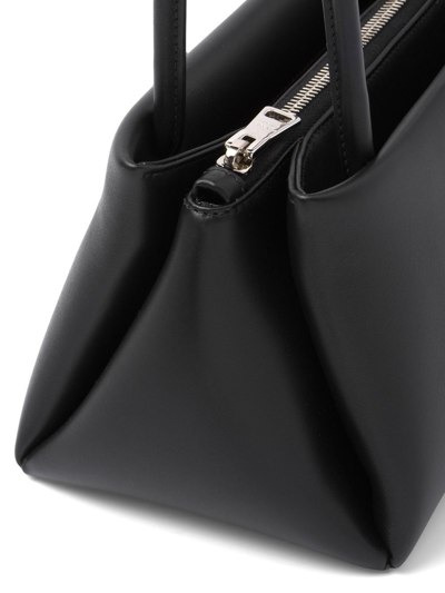 Shop Prada Small Logo-embossed Shoulder Bag In Black