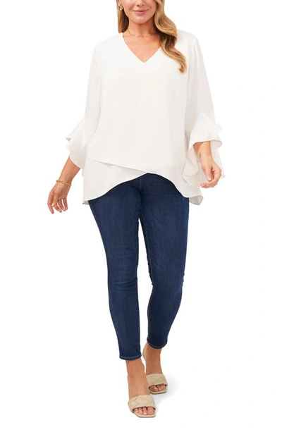 Shop Vince Camuto Flutter Sleeve Crossover Georgette Tunic Top In White