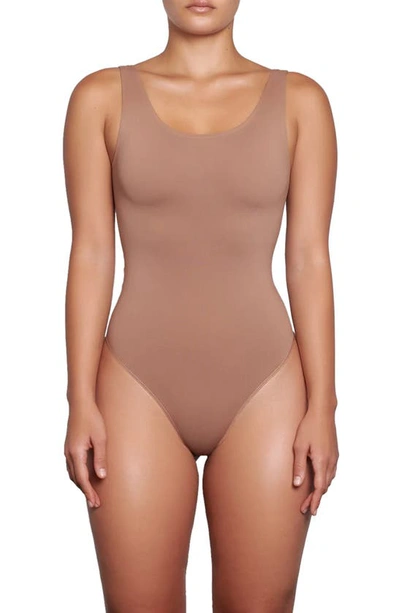 Shop Skims Soft Smoothing Thong Bodysuit In Clay