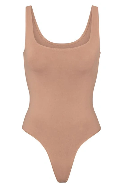 Shop Skims Soft Smoothing Seamless Thong Bodysuit In Clay