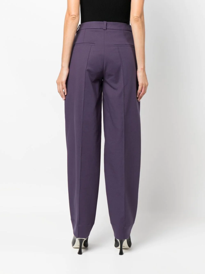 Shop Aeron Tapered-leg Wool Trousers In Violett