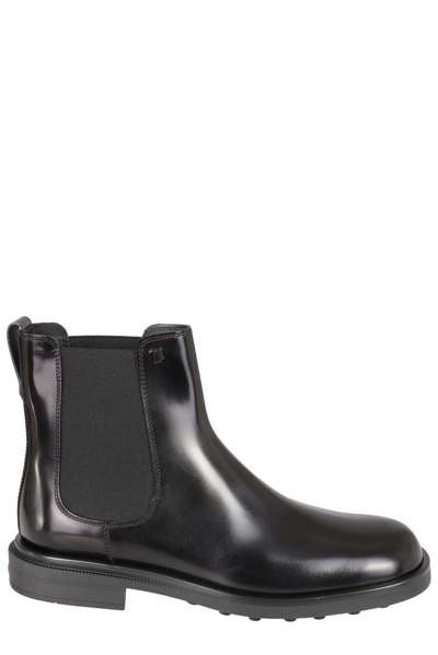 Shop Tod's Logo Detailed Round Toe Boots In Nero