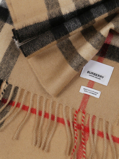 Shop Burberry Checked Fringed Scarf In Beige