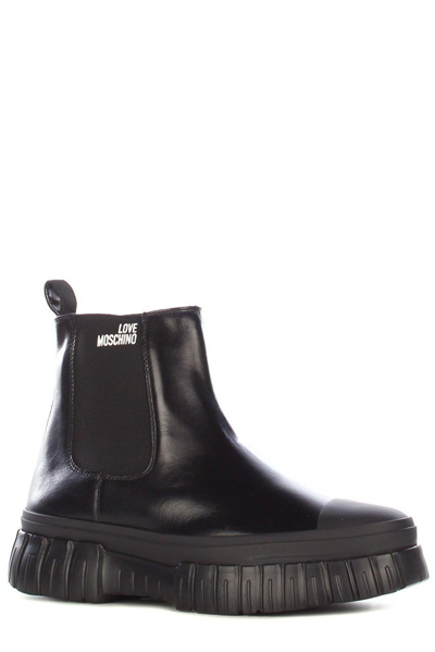 Shop Love Moschino Logo Printed Chunky Boots In Nero