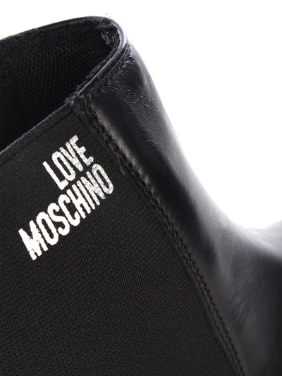 Shop Love Moschino Logo Printed Chunky Boots In Nero