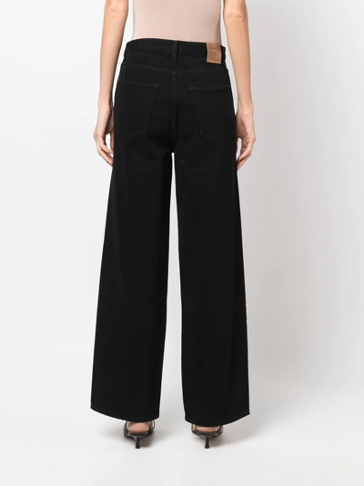 Totême High-waisted Flared Jeans In Black