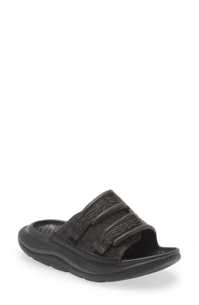 Shop Hoka Gender Inclusive Ora Luxe Slide Sandal In Black / Black