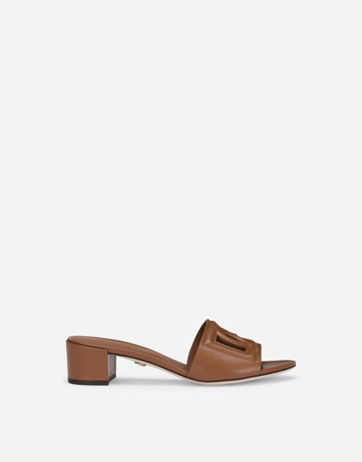 Shop Dolce & Gabbana Calfskin Mules With Dg Millennials Logo In Brown